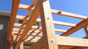 Professional deck construction showing completed pressure-treated wood deck frame with posts, beams, and joists properly assembled with galvanized fasteners and hardware visible in bright daylight