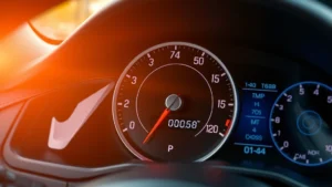 A digital speedometer showing acceleration from 0 to 60 mph with a clear time display, photorealistic modern car dashboard with blurred motion in background